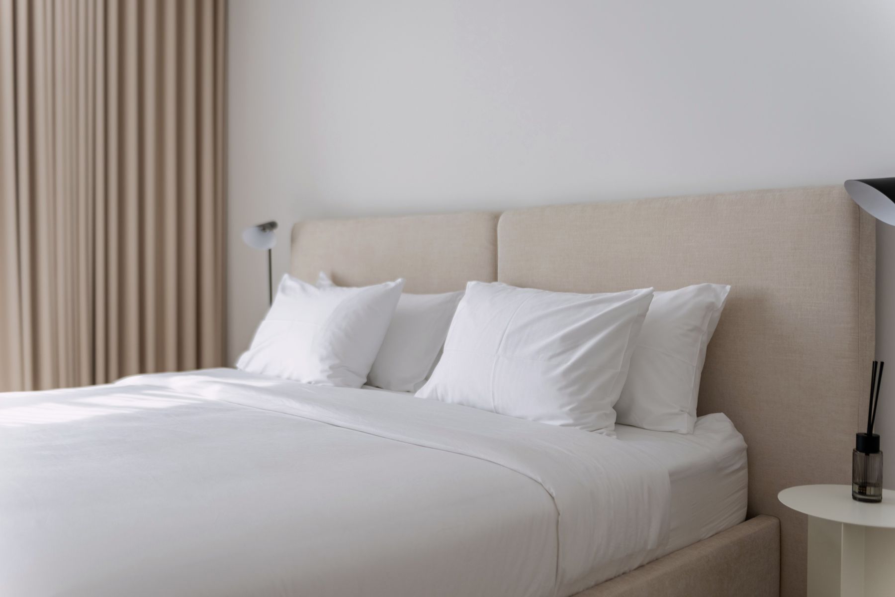 A clean, welcoming bedroom prepared for short-term rental guests